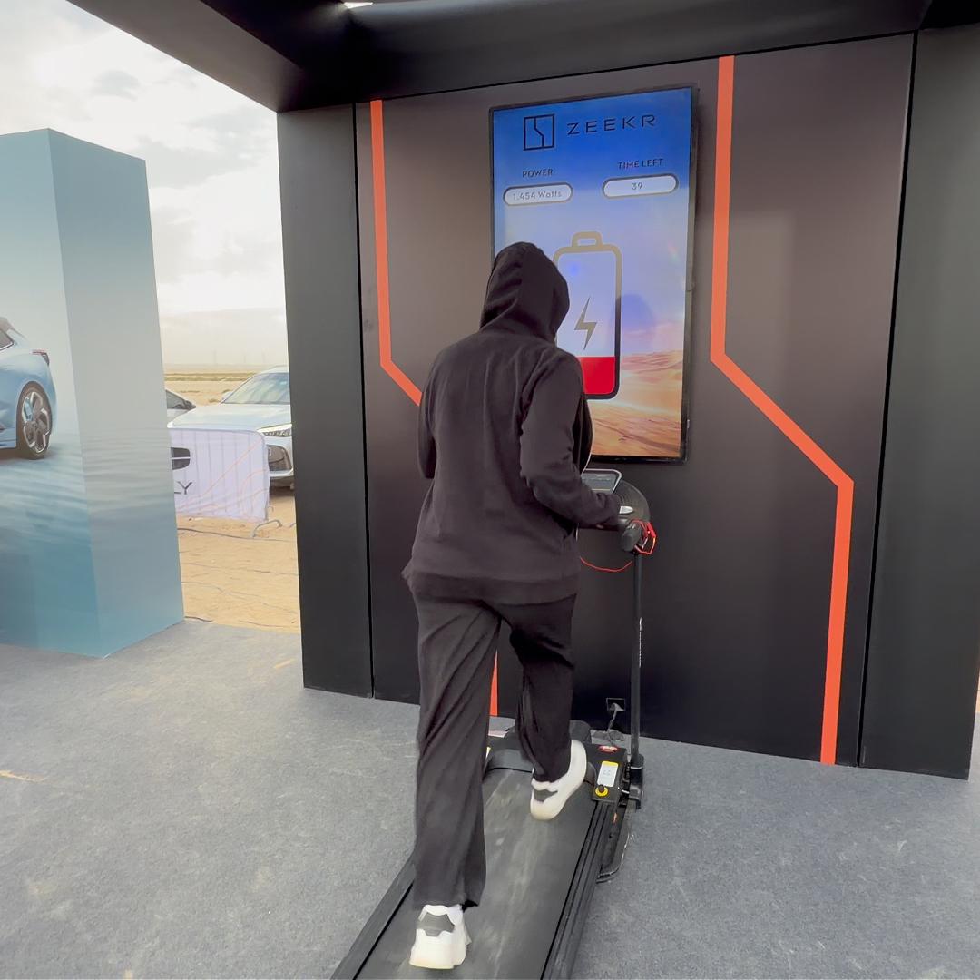 Interactive Treadmill Activation in Dubai: Participants generating human power to recharge EV cars